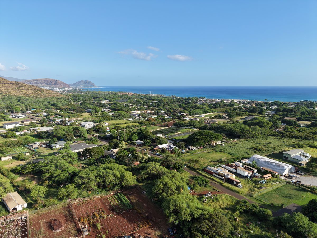 Aerial view of an Oʻahu valley, ridge and ocean beyond